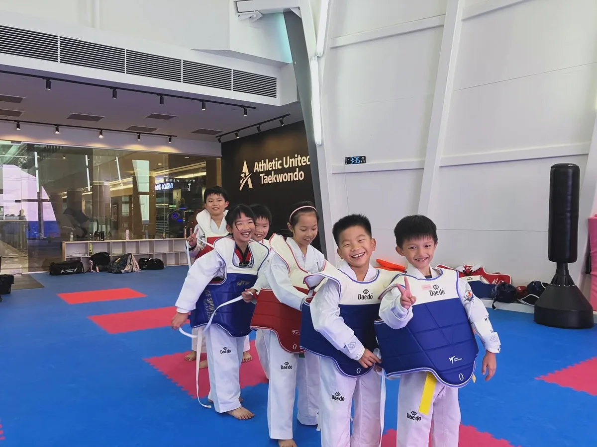 Young taekwondo students in sparring chest guards at Athletic United Taekwondo